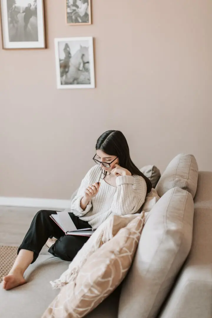 pexels-woman on couch journaling